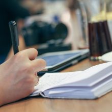 Freelance writers interview people and take notes for their magazine articles and blog posts.