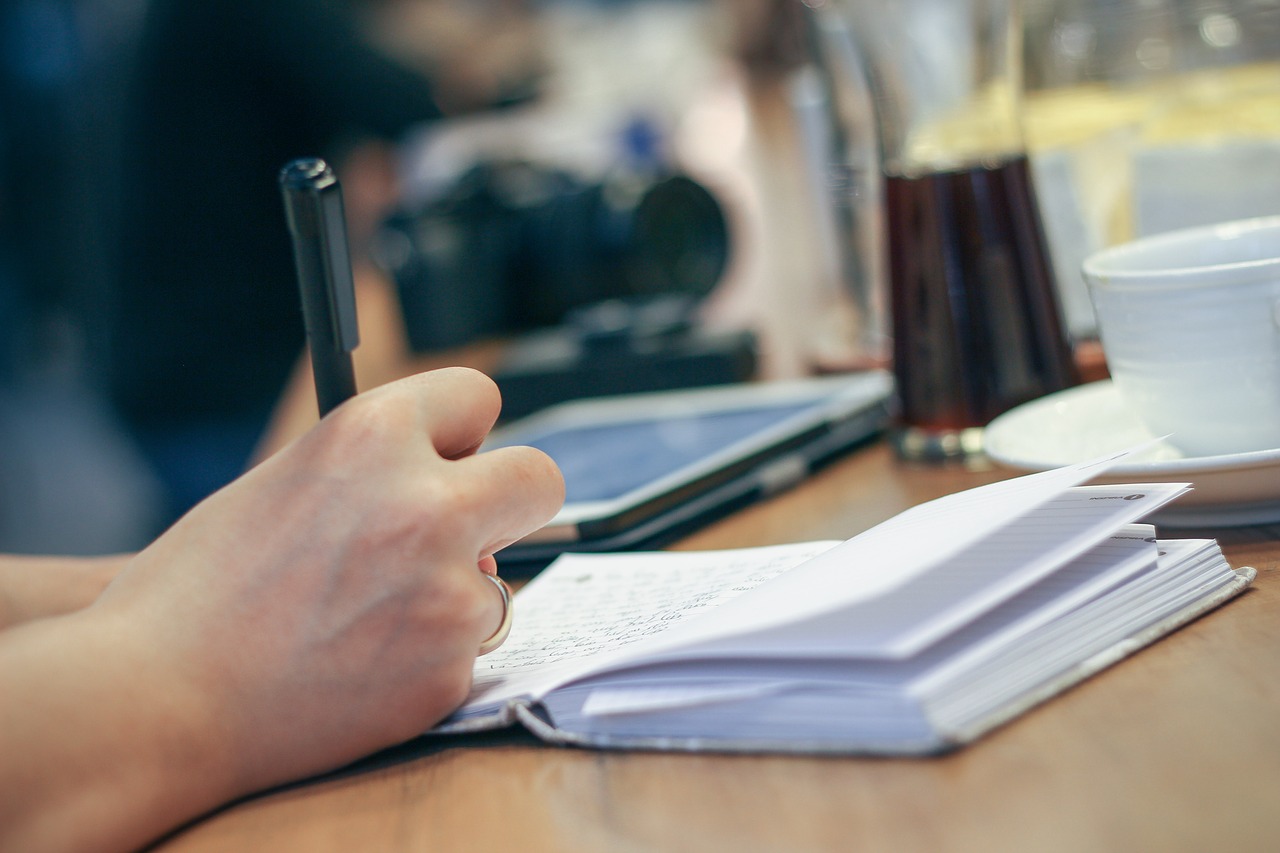 Freelance writers interview people and take notes for their magazine articles and blog posts.