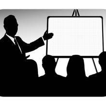 Freelance writer gives a presentation to clients during a meeting.