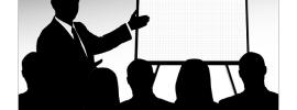 Freelance writer gives a presentation to clients during a meeting.
